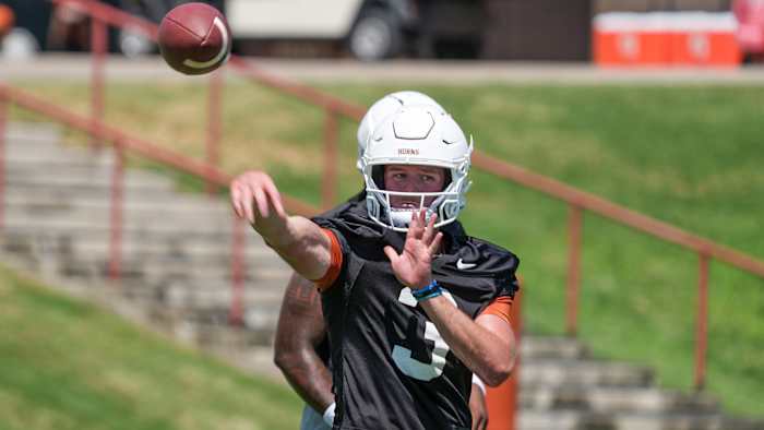 Texas Longhorn Quinn Ewers passes the ball during their first pre-season practice .